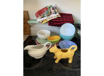 K/ Assorted Kitchen Towels, Bowls, Plates, Cow Shaped Creamer, Gravy Boat