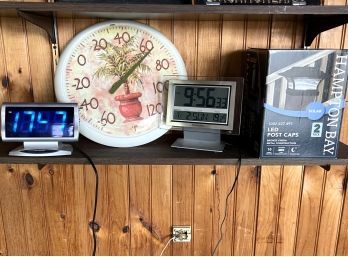 BP/ 2 Electric Clocks, 1 Round Thermometer, 1 Solar LED Post Cap Light