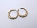 Lot 44- 14K Gold Hoop Earrings With Swirl Pattern