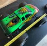 Lot 265 - RC Remote Control Bright Green Monster Truck With Fire Decals