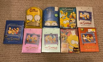 Lot 224- The Simpsons 9 Seasons DVDs Collection Some Sealed & New