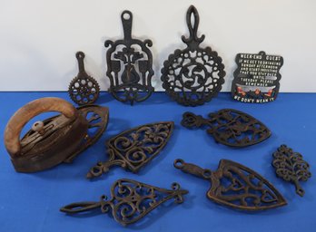 Lot 288-  Large Lot Of Antique Cast Iron Trivets & Iron With Stand