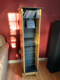 Lot 217- Rotating Double Sided Dvd Cd Stand With Glass Shelves