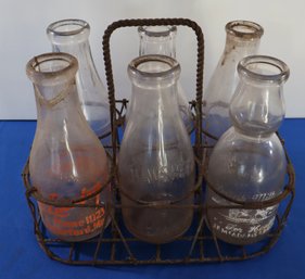 Lot 223- Advertising 6 Milk Bottles In Metal Carrier - H.P. Hood - Shawsheen - Whiting - Landry