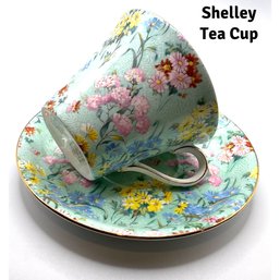 Lot 106- Shelley Fine Bone China Melody Tea Cup & Saucer Aqua With Flowers England