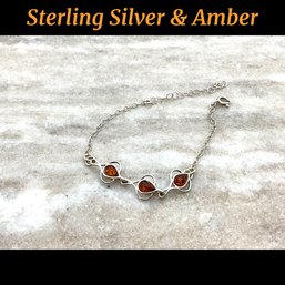 Lot 204- Sterling Silver And Amber Bracelet