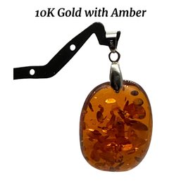 Lot 126- 10K Gold With Amber Oval Pendant