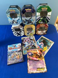 Lot 47 - Small Collection Of Pokemon Empty Tins, DVD Rise Of Darkrai, Oversized Cards