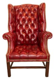 Lot 25- Chesterfield Red Leather Tufted Wing Chair