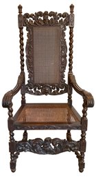 Lot 28- Antique Carved Wood Cherub Arm Chair With Cane Back