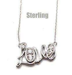 Lot 12: Sterling Silver LOVE Necklace With CZ Crystal 18 Inch Chain