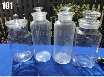 Lot 101 - Vintage - 4 Clear Apothecary Glass Jars With Covers