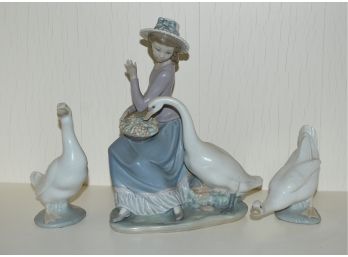 Lladro Figure And Two Swans