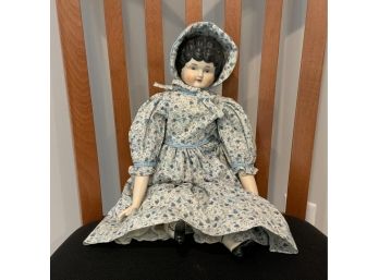 China Head Doll And A Small Box Of Doll's Clothing (CTF10)