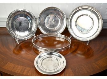 Five Piece Sterling Lot: Four Circular Trays Along With Oval Serving Tray With Wood Bottom, 18.9 Ozt (CTF10)