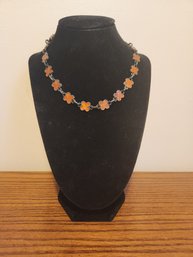 Orange Four Leaf Clover Pendants Necklace On Dark Grey Metal Gray