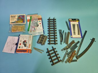 Lot Of Model Train Accessories Tracks Different Sizes Gearboxes And Horse Drawn Carriage Punchout Figures