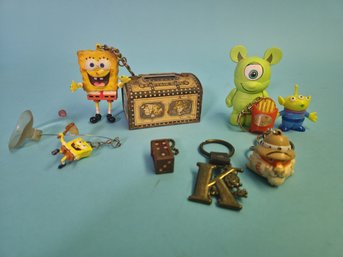 Vintage Keychains And Ephemera Pair Of Dice, Mickey Mouse, Spongebob, Captain Kidd, Pixar, Exxon