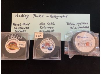 Autographed Hockey Pucks (3)