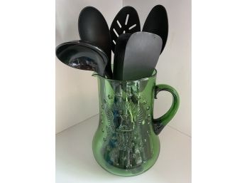 Green Glass Pitcher With Assorted Utensils