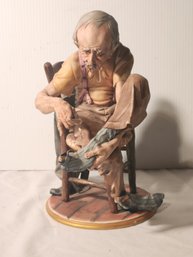 Capa Di Monte Porcelain Figurine Depicting Man Mending Sock