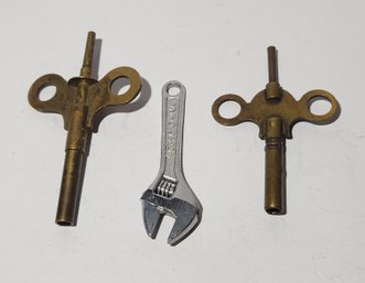 Two Antique Brass Double Ended Clock Keys And A Miniature Cresent Wrench