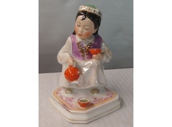 Porcelain Figurine Of Asian Girl Pouring Tea
