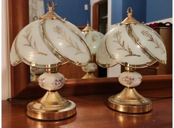 Pair Of Brass Tone And Glass Touch Lamps With Floral Decorated Ceramic Fonts