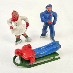 Small Lead Christmas Figures - Skaters And Sledder