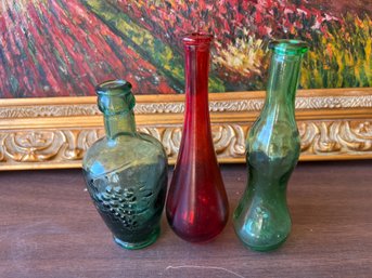 Three Vintage Colored Glass Bottles