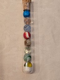 Glass Tube Of Vintage Marbles