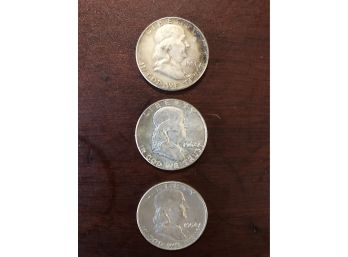 Three Franklin Half Dollars