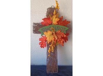 A Harvest Cross Made Out Of Faux Leaves With A Banner That Says 'blessings'