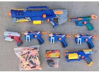 A Large Assortment Of Nerf Guns With Ammo
