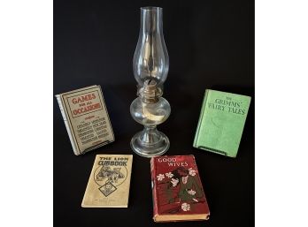 A Collection Of Vintage Items Inc. Hurricane Lamp, Good Wives, Games For All Occasions And More