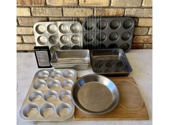 A Collection Of Bakeware Inc. Bake King Loaf Pans, Cutting Board, Muffin Pans And More
