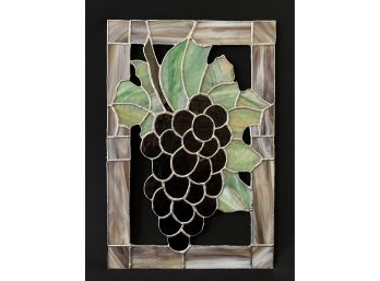 A Pretty Stained Glass Piece With Purple Grapes And Foilage