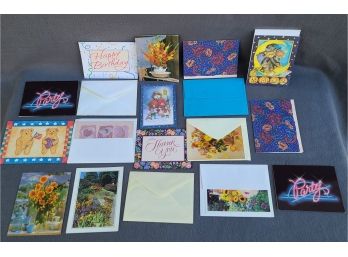 An Assortment Of Blank Cards And Envelopes