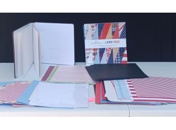 A Large Assortment Of Various Colors Of Scrapbooking Paper With An Album