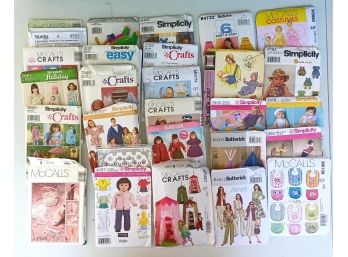 An Assortment Of Sewing Patterns Inc. Baby Clothes And Bids, And Other Craft Projects