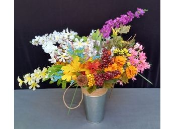 A Very Colorful Faux Boquet In A Tin Vase With Twine