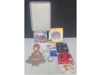 A Large Collection Of Bakeware Inc. Donut Silicone Mold, Cookie Cutters And More