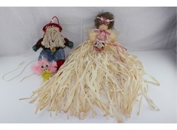 3 Dolls Includes One Ganz Santa Claus, A Raffia Doll And A Small Girl In A Yellow Dress With Pink Hair