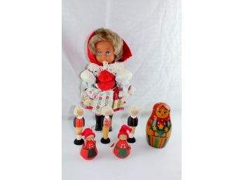 A Babushka Doll Set, A Plastic And Vinyl Doll And Small Wooden Figures Made In Sweden