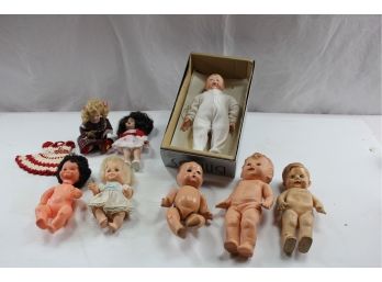 8 Small Dolls