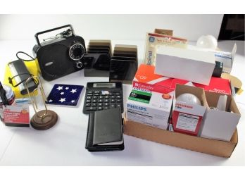 Office Items – Radio, Flashlights, Calculators, Assortment Of Light Bulbs