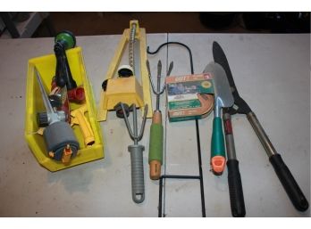 Assortment Of Outdoor Tools And Sprinklers