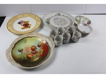 Decorative Plates And Tiny Tea Cups And Saucers