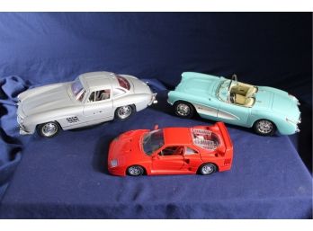 3 Burago Diecast Cars- Teal Corvette, Silver Porsche, Red Ferrari