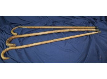 Three Wooden Canes, One Is Split